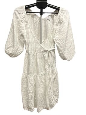 Love, Whit by Whitney Port. White Gauze Wrap Dress with Puff Sleeves.